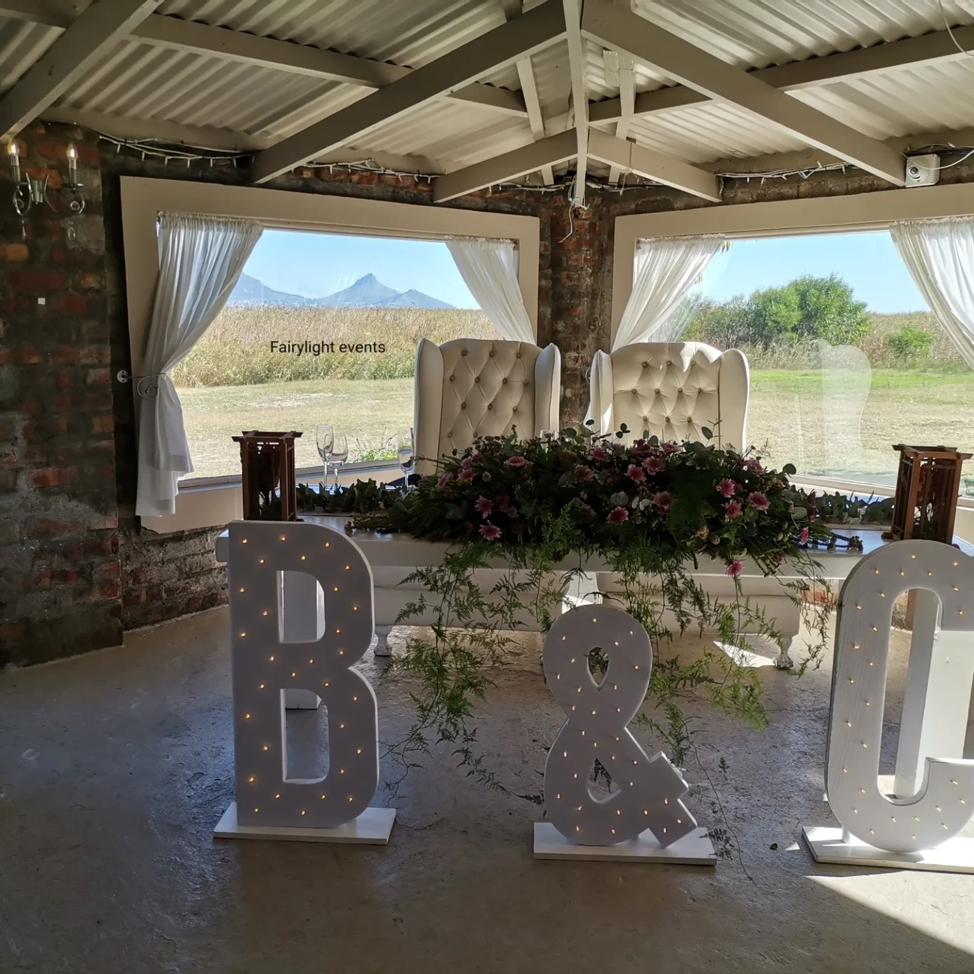 Light-up marquee letters and floral wedding décor by Fairylight Events