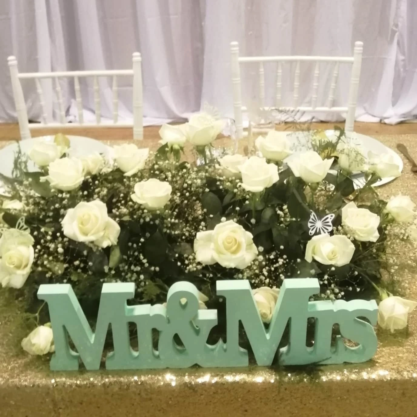 Mint green Mr and Mrs table sign with white rose florals